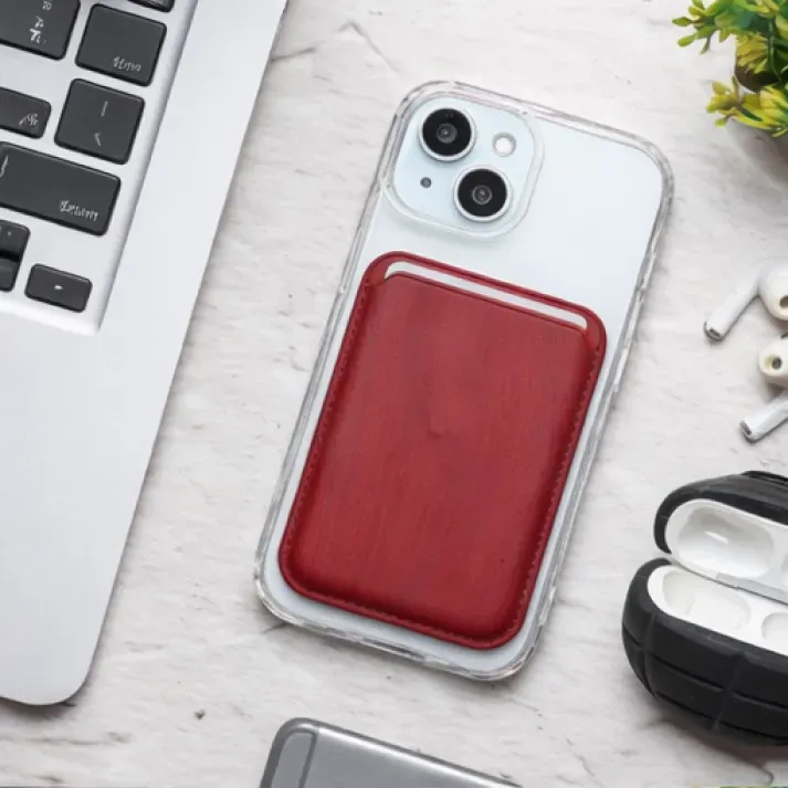 Red wooden texture MagSafe wallet attached to a clear iPhone case.