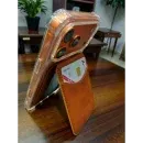 Appdroid MagSafe wallet in Saddle Brown magnetically attached to iPhone 15 Pro Max with clear case, showing secure fit for iPhone 12-17