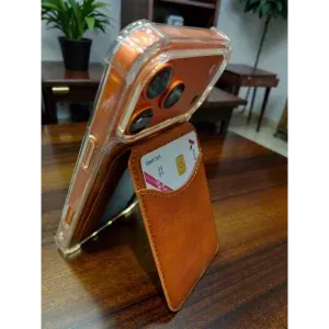 Appdroid MagSafe wallet in Saddle Brown magnetically attached to iPhone 15 Pro Max with clear case, showing secure fit for iPhone 12-17