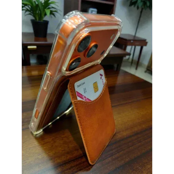 Appdroid MagSafe wallet in Saddle Brown magnetically attached to iPhone 15 Pro Max with clear case, showing secure fit for iPhone 12-17